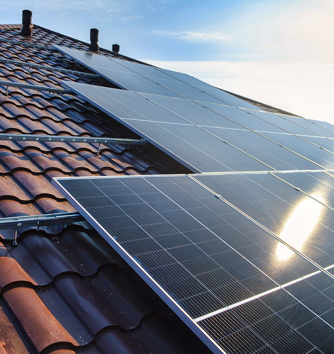 Roof of house with solar panels installed.